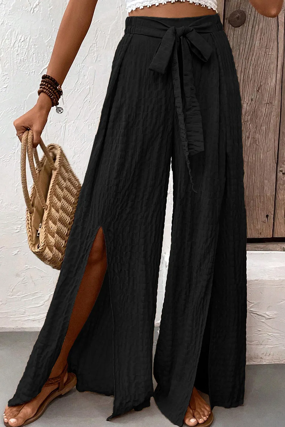 Blue Zone Planet |  Black Crinkle Texture Knot Waist Slits Flared Pants