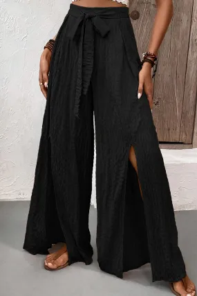 Blue Zone Planet |  Black Crinkle Texture Knot Waist Slits Flared Pants